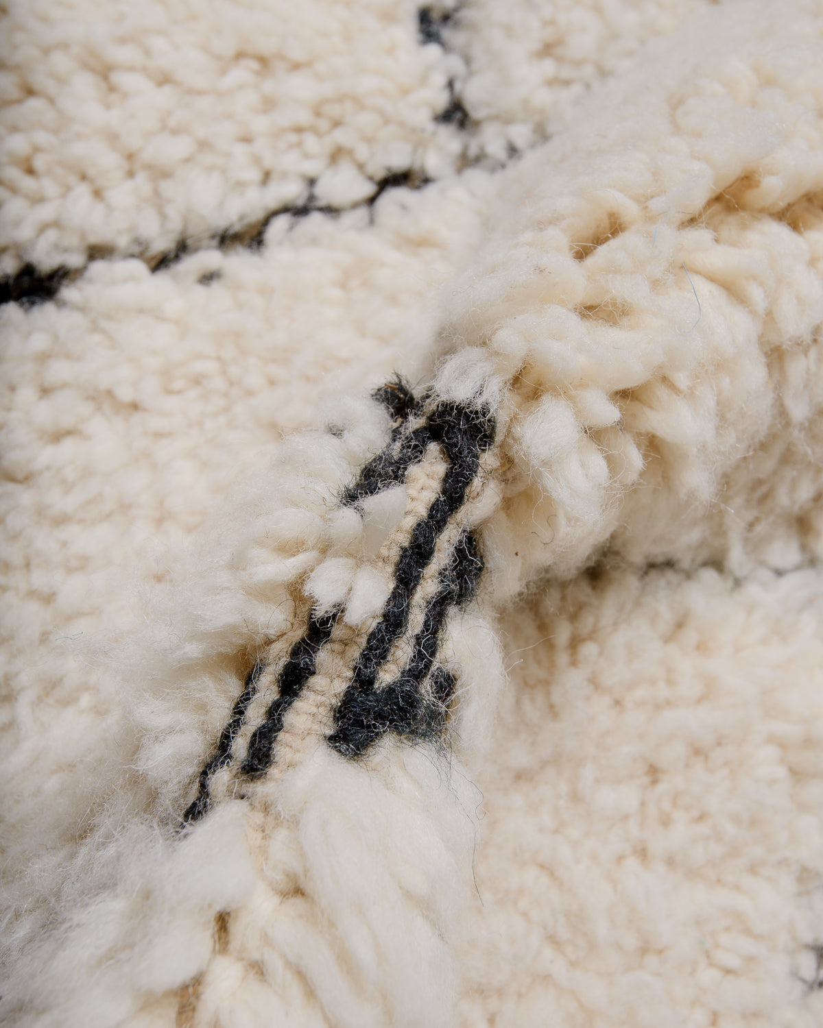 Modern, designer, handcrafted Berber rug from Morocco. Beniourain carpet with beautiful colours and patterns and fluffy wool texture.